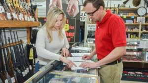 Customer Shopping in retail store fiearms by NSSF e991f65cda8cad0d03a7ea8cd2674507