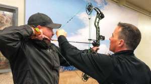 Cropped SGS98 Al Kraus Black Hills Archery assists a customer with setting the peep sight correctly copyright f4159788da6a13a05c7755e7e3b29890 220502 112503